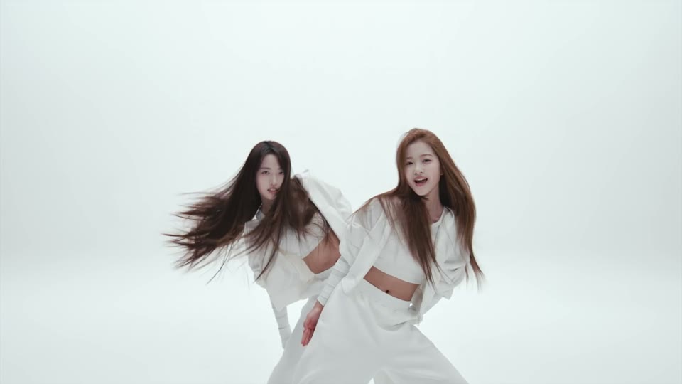 Two performers aligned during the partner entrance in the NEON dance intro