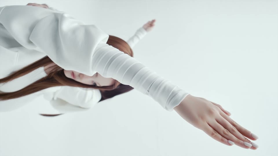 Close view of the arm and hand accent in the NEON dance sequence